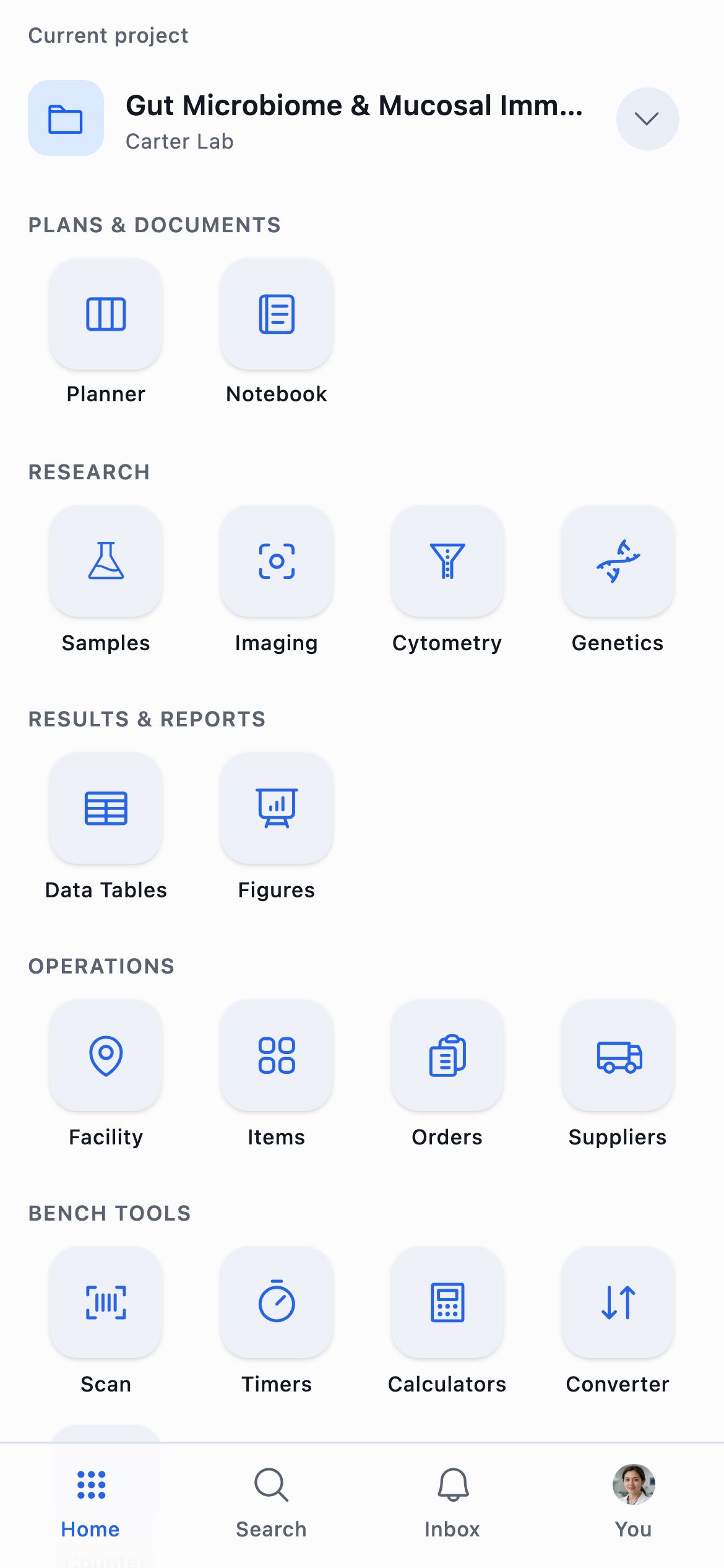The phone home screen with the current project at the top, the workspace grid, Bench Tools beneath it, and four tabs along the bottom